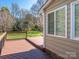 Wooden back deck and railing with view to yard at 9307 Harlow Creek Rd, Huntersville, NC 28078