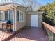 The back deck has wooden floors and railing with a door to the outside and a grill for outdoor entertaining at 9307 Harlow Creek Rd, Huntersville, NC 28078