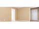 Empty bedroom with beige carpet and walls with 2 closets and two doors at 9307 Harlow Creek Rd, Huntersville, NC 28078