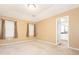 Neutral bedroom with carpet, two windows, with entry to the bathroom at 9307 Harlow Creek Rd, Huntersville, NC 28078
