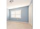Bedroom with light blue walls, carpet flooring, a large window, and a closet at 9307 Harlow Creek Rd, Huntersville, NC 28078