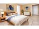 Comfortable bedroom with hardwood bed frame and accent artwork at 9307 Harlow Creek Rd, Huntersville, NC 28078