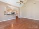 Hardwood floors with vaulted ceilings and neutral paint throughout the spacious living room at 9307 Harlow Creek Rd, Huntersville, NC 28078