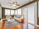 Well-lit living room features hardwood floors, large windows, and comfortable seating at 9307 Harlow Creek Rd, Huntersville, NC 28078