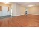 Inviting foyer with hardwood flooring leading into a spacious and bright living area at 9307 Harlow Creek Rd, Huntersville, NC 28078