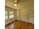 Sun-lit bedroom with hardwood floors, large windows, and ample closet space at 1003 Woodland Dr, Gastonia, NC 28054