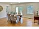 Elegant dining room with hardwood floors and a view to outdoor deck at 1003 Woodland Dr, Gastonia, NC 28054
