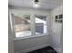 Bright entryway features tile floor, neutral paint, and large windows offering views of the backyard at 1003 Woodland Dr, Gastonia, NC 28054