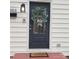Charming front door with welcome wreath and black-and-white striped bow detail at 1003 Woodland Dr, Gastonia, NC 28054