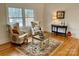 Comfortable living room with hardwood floors, a decorative rug, and natural light at 1003 Woodland Dr, Gastonia, NC 28054