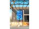 Modern commercial building featuring HEX Coffee Kitchen & Natural Wines with black brick and an artistic mural below at 1011 Carter Ave # 35, Charlotte, NC 28206