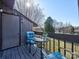 Inviting balcony seating area with a table and a serene outdoor view at 1022 Mallard Head Ln, Mooresville, NC 28117