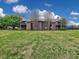 Condo building with wood siding, balconies, and mature trees, set on a sprawling green lawn at 1022 Mallard Head Ln, Mooresville, NC 28117