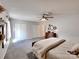 Spacious main bedroom featuring a ceiling fan, area rug, large closets and natural light at 1022 Mallard Head Ln, Mooresville, NC 28117