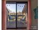 View of the outdoor patio with seating, accessible through sliding glass doors at 1022 Mallard Head Ln, Mooresville, NC 28117