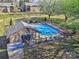 Community pool surrounded by a black fence, with a covered picnic area for residents to enjoy the outdoors at 1022 Mallard Head Ln, Mooresville, NC 28117