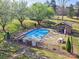 Overhead shot of a fenced community pool with an outdoor picnic and grilling area at 1022 Mallard Head Ln, Mooresville, NC 28117