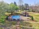 Overhead shot of a fenced community pool with an outdoor picnic and grilling area at 1022 Mallard Head Ln, Mooresville, NC 28117