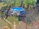 Aerial view of a fenced-in community swimming pool and surrounding landscape at 1022 Mallard Head Ln, Mooresville, NC 28117