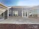 Spacious backyard patio featuring a screened in porch at 1063 Millview Ln, Matthews, NC 28104