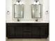 Modern bathroom features double vanity with undermount sinks, framed mirrors, and upgraded light fixtures at 1063 Millview Ln, Matthews, NC 28104