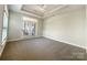 Bright bedroom featuring carpeted floors, a ceiling fan and French doors allowing for ample natural light at 1063 Millview Ln, Matthews, NC 28104