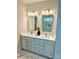 A double sink bathroom vanity features modern fixtures, gold hardware, and an elegant marble floor at 109 Seldon Dr, Charlotte, NC 28216