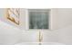 Bright bathroom with a soaking tub, modern gold fixtures, and an elegant window view at 109 Seldon Dr, Charlotte, NC 28216