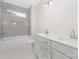 Bathroom featuring double vanity, tiled shower, and grey color palette at 109 Seldon Dr, Charlotte, NC 28216