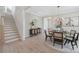 Elegant dining area featuring stylish decor, modern lighting, wood floors, and staircase at 109 Seldon Dr, Charlotte, NC 28216