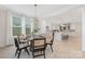 Elegant dining area adjacent to kitchen, with round table, stylish chairs, and ample natural light at 109 Seldon Dr, Charlotte, NC 28216