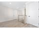 Second floor hallway with white trim and doors, and wood-look flooring at 109 Seldon Dr, Charlotte, NC 28216