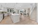 Bright, open kitchen featuring a large island with a marble countertop and modern pendant lighting at 109 Seldon Dr, Charlotte, NC 28216