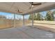 Spacious screened-in porch with ceiling fans and a view of the fenced backyard at 109 Seldon Dr, Charlotte, NC 28216