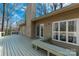 Spacious back deck with built-in seating and views of the wooded surroundings at 11 Woodvine Ln, Clover, SC 29710