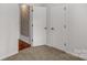 Neutral bedroom offering wall art, carpet, and double door closet at 11 Woodvine Ln, Clover, SC 29710