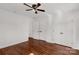 Bright bedroom featuring a ceiling fan, hardwood floors, and ample closet space at 11 Woodvine Ln, Clover, SC 29710