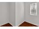A spacious room with hardwood floors, a single window and white walls at 11 Woodvine Ln, Clover, SC 29710