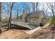 Back of house exterior featuring a wooden deck and mature trees at 11 Woodvine Ln, Clover, SC 29710