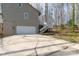 The exterior features an attached garage, plenty of parking space and wooden stairs at 11 Woodvine Ln, Clover, SC 29710