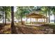 Picturesque lakeside gazebo with picnic tables, great for outdoor gatherings and enjoying waterfront views at 11 Woodvine Ln, Clover, SC 29710
