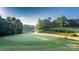 Lush green golf course with water views, offering a serene and recreational setting at 11 Woodvine Ln, Clover, SC 29710