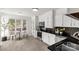 Eat-in kitchen with white cabinetry, stainless appliances, and natural light from large windows at 11 Woodvine Ln, Clover, SC 29710