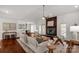 Open-concept living room featuring hardwood floors, a modern fireplace, and abundant natural light at 11 Woodvine Ln, Clover, SC 29710