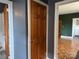 A charming bathroom featuring tiled walls, a black and white tile floor, and wood-paneled doors at 1121 Myrtle Ave # 17, Charlotte, NC 28203