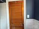 Bathroom with white subway tile, chrome towel bar and wood paneled door at 1121 Myrtle Ave # 17, Charlotte, NC 28203