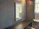 A neutral bedroom featuring a vintage-style mirror and decorative wood floors at 1121 Myrtle Ave # 17, Charlotte, NC 28203