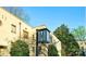Well-maintained apartment building with 'M' light post out front and green landscaping at 1121 Myrtle Ave # 17, Charlotte, NC 28203