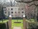 Apartment buildings with lawns, mature trees, and manicured landscape at 1121 Myrtle Ave # 17, Charlotte, NC 28203