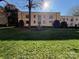 Apartment complex featuring a well-maintained lawn and mature landscaping in a lush, sunny setting at 1121 Myrtle Ave # 17, Charlotte, NC 28203